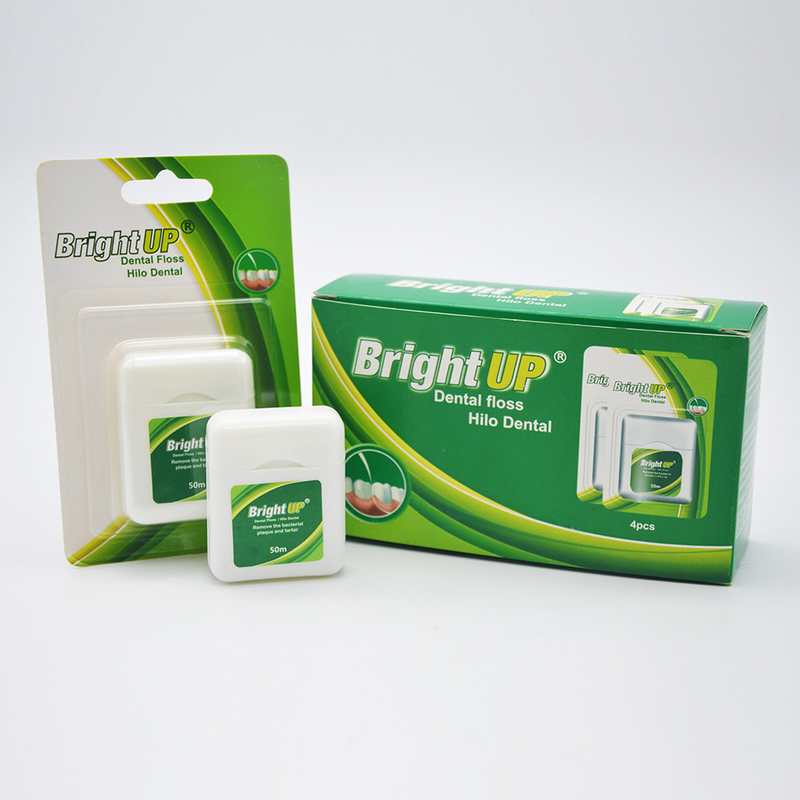 Il contenitore biodegradabile di erbe di filo per i denti o il filo per i denti seleziona la cura orale vi tiene sorriso
