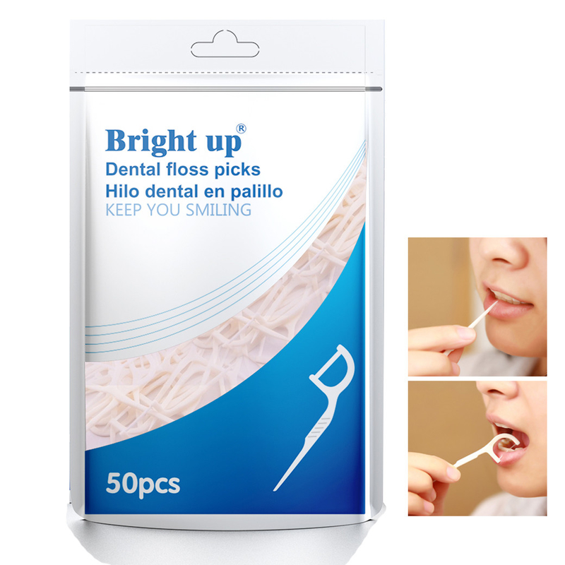 Il contenitore biodegradabile di erbe di filo per i denti o il filo per i denti seleziona la cura orale vi tiene sorriso
