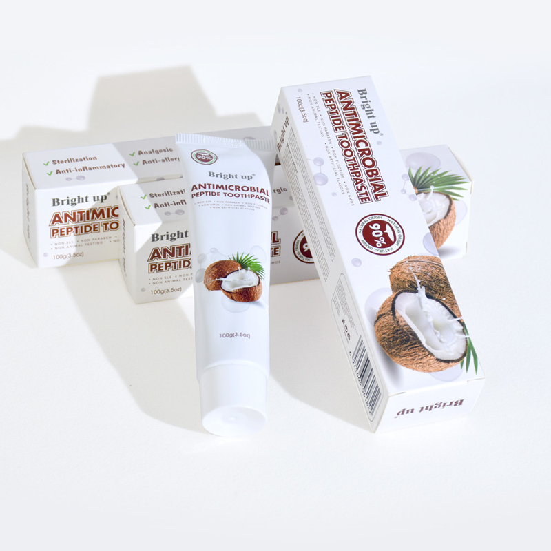 Crema dentale peptidica antimicrobica di alta qualità, 100 g per tubo di olio di cocco all'ingrosso